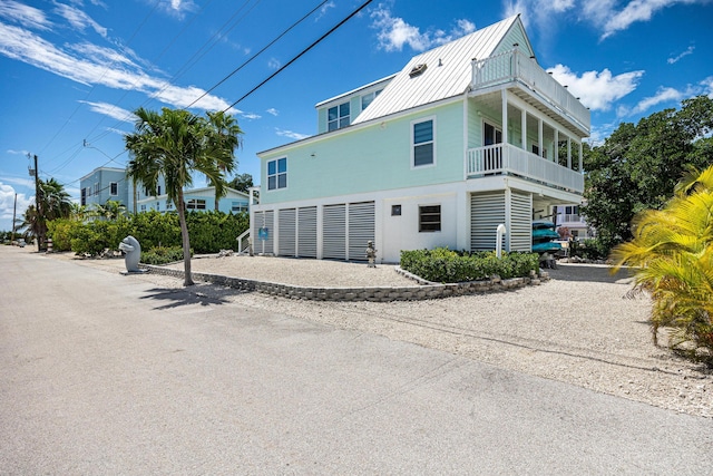 view of side of property with a balcony