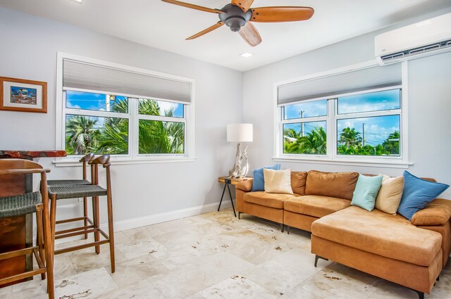 living room with ceiling fan and a wall mounted AC