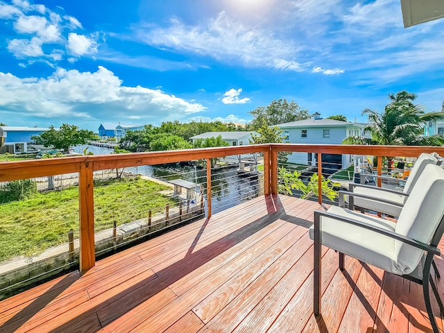 wooden terrace with a water view