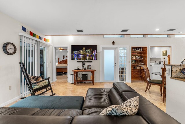 living room with washing machine and dryer