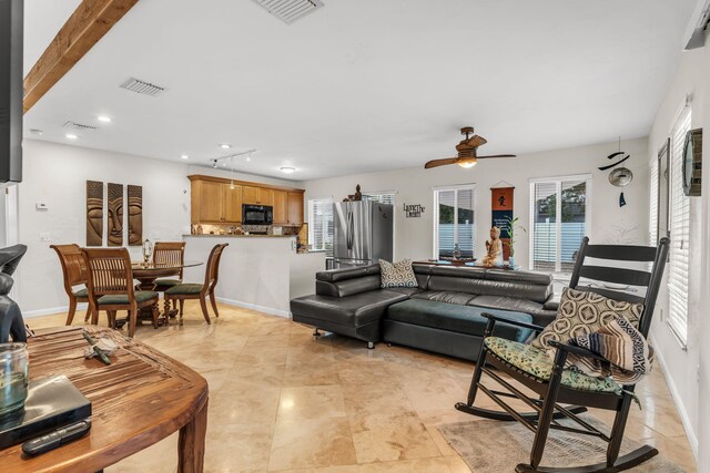 living room featuring ceiling fan