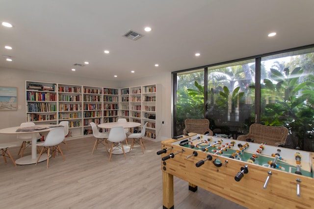 96000 Overseas Hwy Unit X2336Ftslip, Key Largo, FL 33037 - rec room with recessed lighting, wood finished floors, visible vents, and expansive windows
