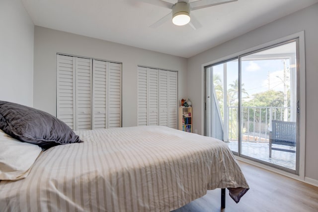 bedroom featuring ceiling fan, two closets, access to outside, and light hardwood / wood-style floors