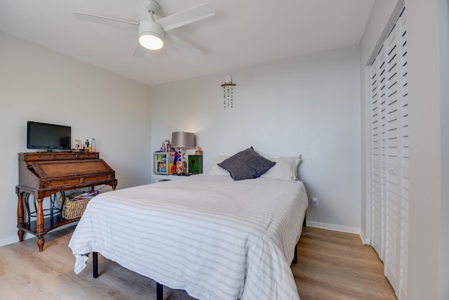 bedroom with ceiling fan and light hardwood / wood-style flooring