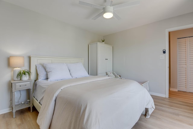 bedroom featuring ceiling fan and light hardwood / wood-style floors