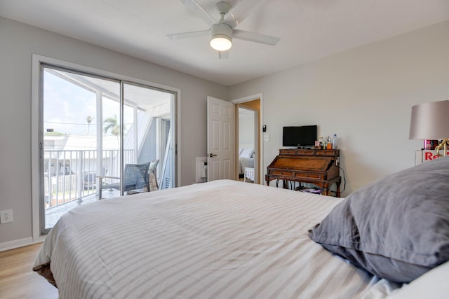 bedroom featuring ceiling fan, light wood-type flooring, and access to outside