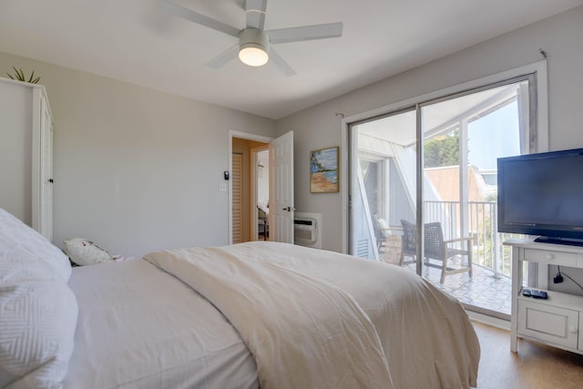 bedroom featuring ceiling fan, light hardwood / wood-style flooring, and access to outside