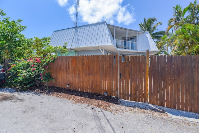 view of side of property featuring a balcony