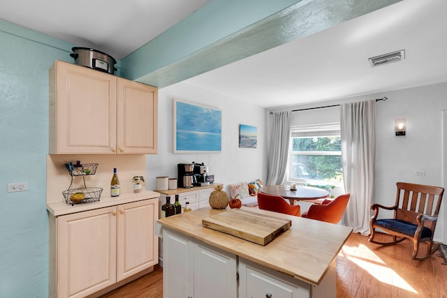 kitchen with light hardwood / wood-style floors and wooden counters