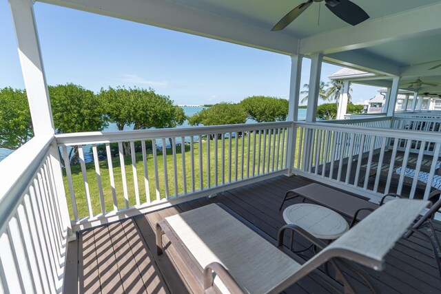 deck featuring a lawn and ceiling fan