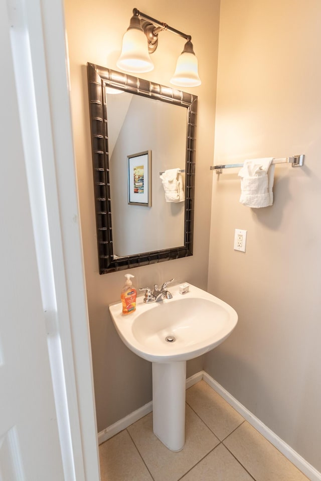 bathroom featuring sink and tile patterned flooring