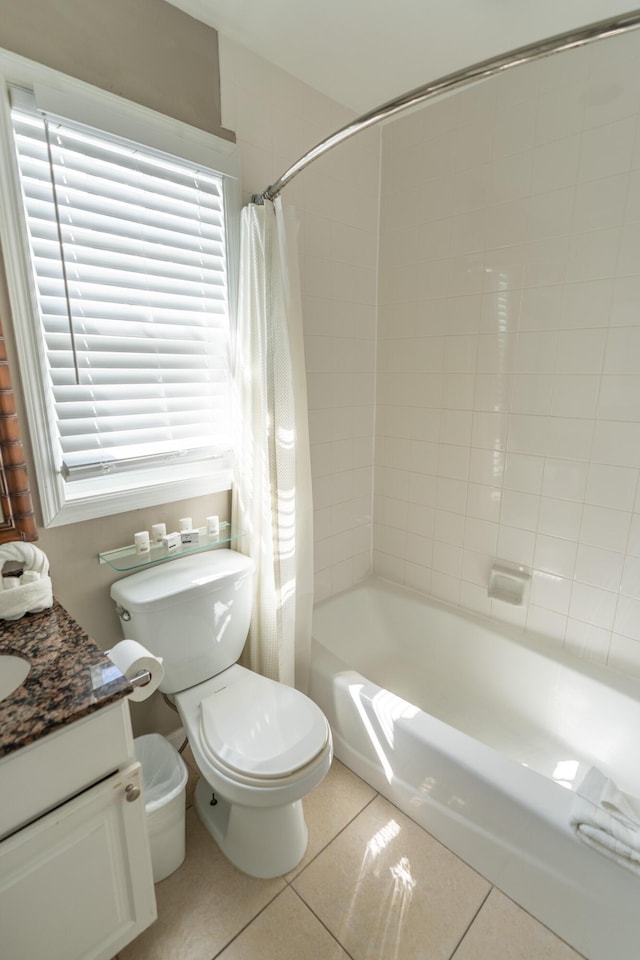 full bathroom featuring vanity, tile patterned floors, shower / bath combo with shower curtain, and toilet