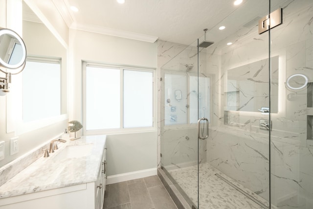 bathroom with a marble finish shower, baseboards, crown molding, vanity, and recessed lighting