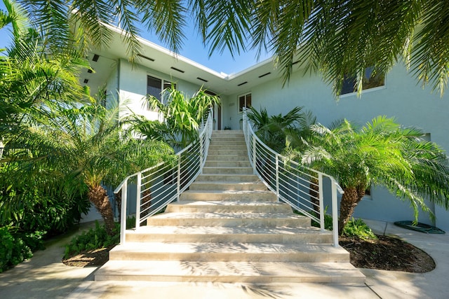 doorway to property with stucco siding