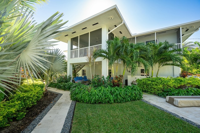 view of property exterior featuring a lawn