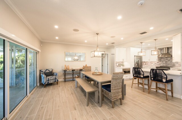 dining room featuring crown molding