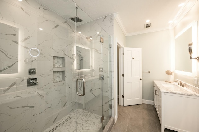 full bath featuring vanity, a marble finish shower, visible vents, and crown molding