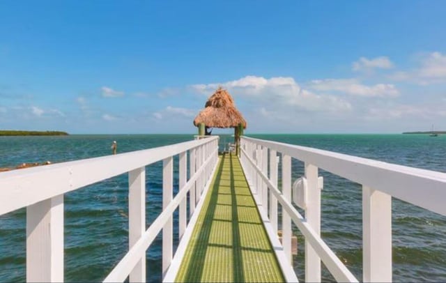 view of dock featuring a water view and a gazebo