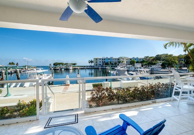 exterior space featuring a water view and ceiling fan