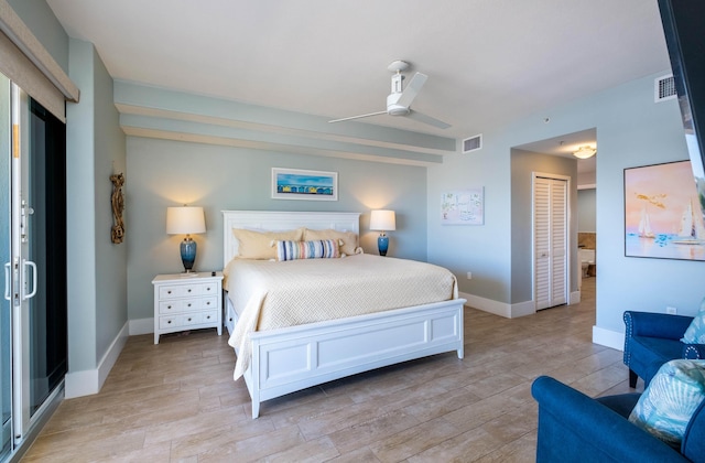 bedroom with ceiling fan, light wood-type flooring, and a closet