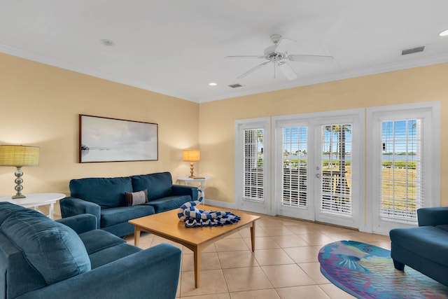 living room with light tile patterned flooring, ceiling fan, ornamental molding, and french doors