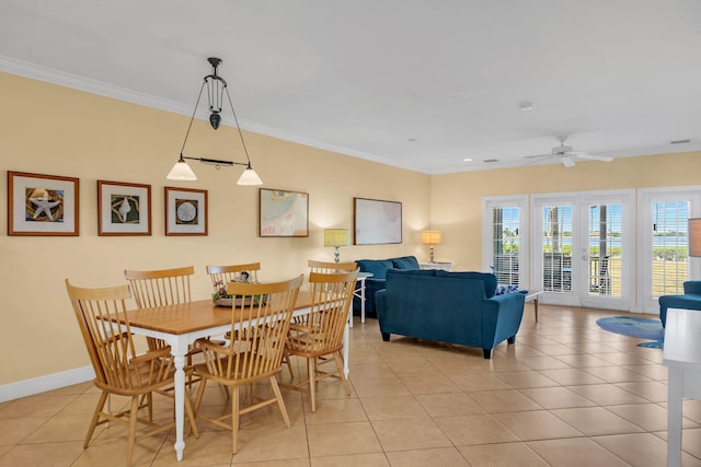 dining room featuring ornamental molding, light tile patterned flooring, ceiling fan, and french doors