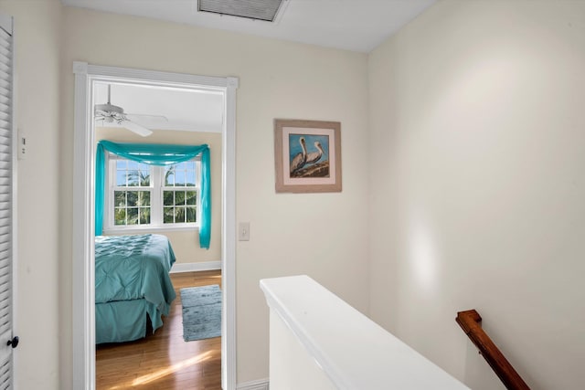 corridor featuring hardwood / wood-style floors