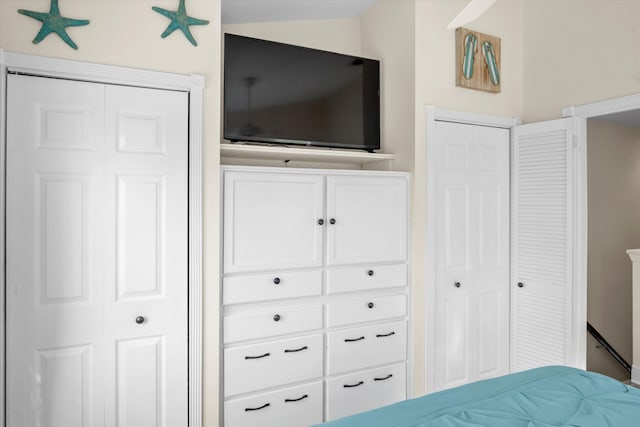 unfurnished bedroom featuring lofted ceiling