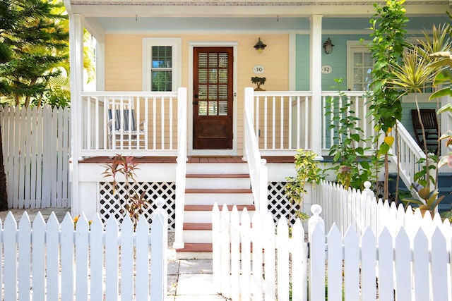 property entrance featuring covered porch