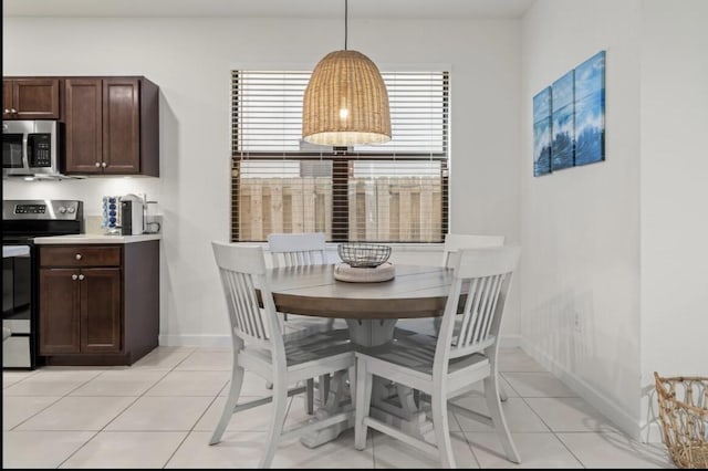 dining space with light tile patterned flooring