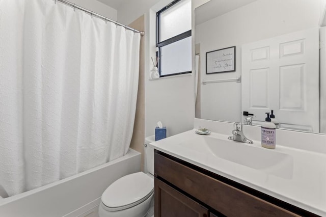 full bathroom with vanity, shower / bath combo, and toilet