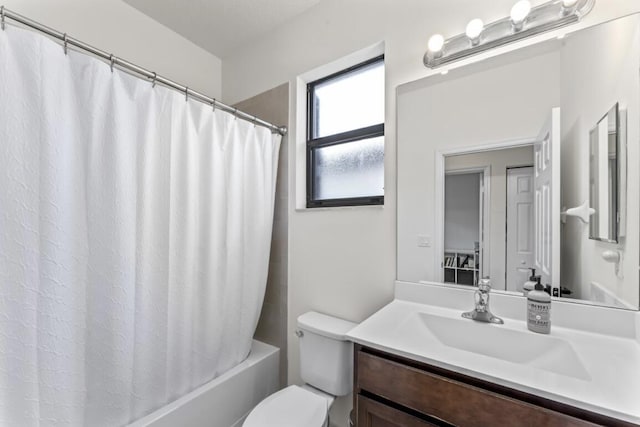 full bathroom featuring vanity, toilet, and shower / bath combo