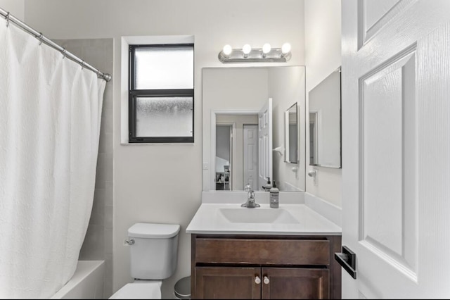 full bathroom featuring vanity, toilet, and shower / tub combo with curtain