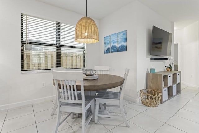 dining area with light tile patterned floors