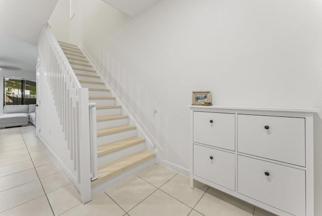 stairs featuring tile patterned floors