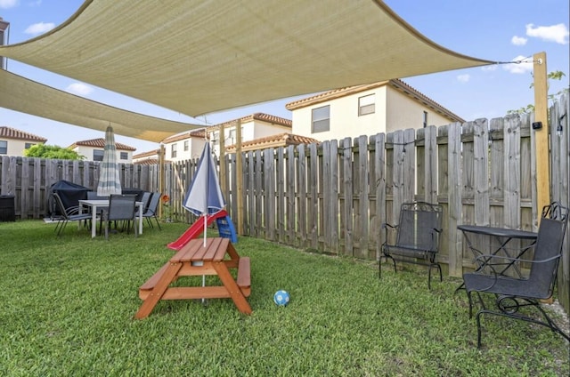 view of jungle gym with a lawn