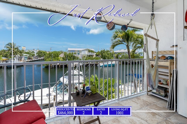 balcony featuring a water view