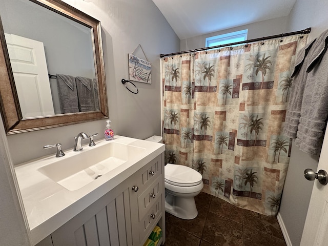 bathroom with a shower with shower curtain, tile patterned flooring, vanity, and toilet