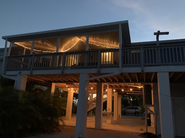 rear view of property with stairs