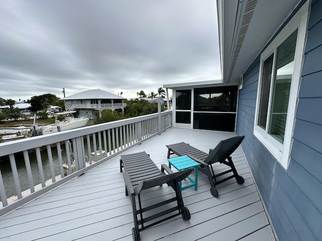 wooden terrace with a sunroom