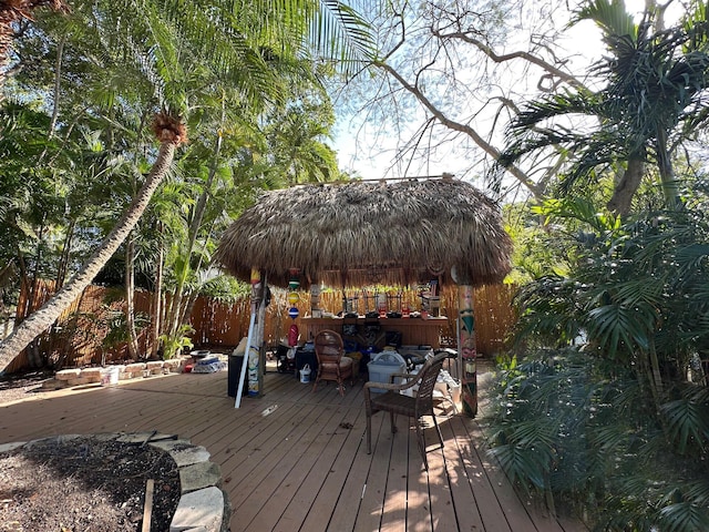 wooden terrace with fence and a gazebo