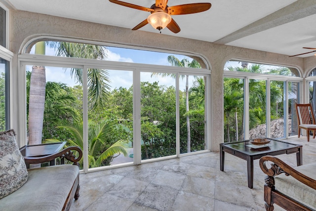 sunroom with ceiling fan