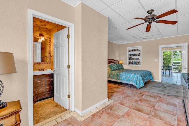 bedroom with light tile patterned flooring, sink, a paneled ceiling, and ceiling fan