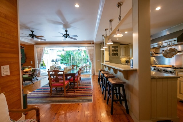 dining room with recessed lighting and light wood-style floors