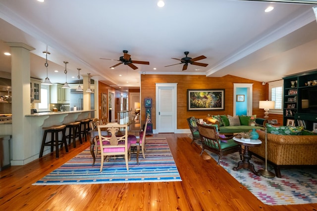 dining room with recessed lighting, ornamental molding, vaulted ceiling, ceiling fan, and wood finished floors