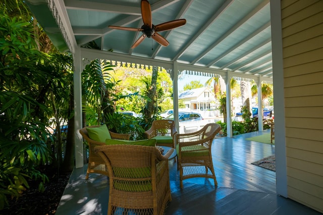 exterior space with ceiling fan