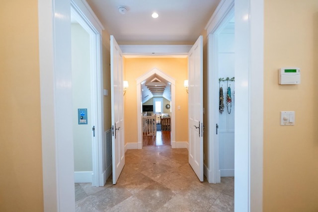 hallway featuring baseboards