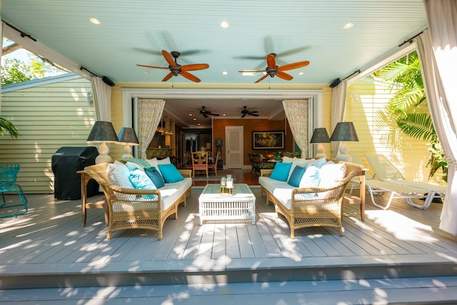 exterior space featuring an outdoor hangout area, grilling area, and a ceiling fan