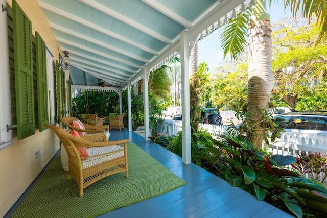 sunroom with vaulted ceiling with beams