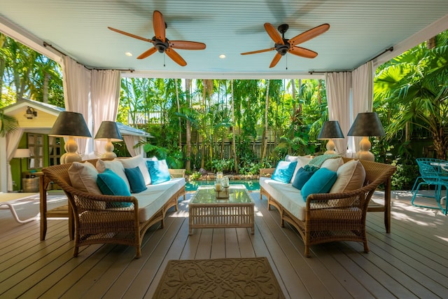 sunroom / solarium with ceiling fan